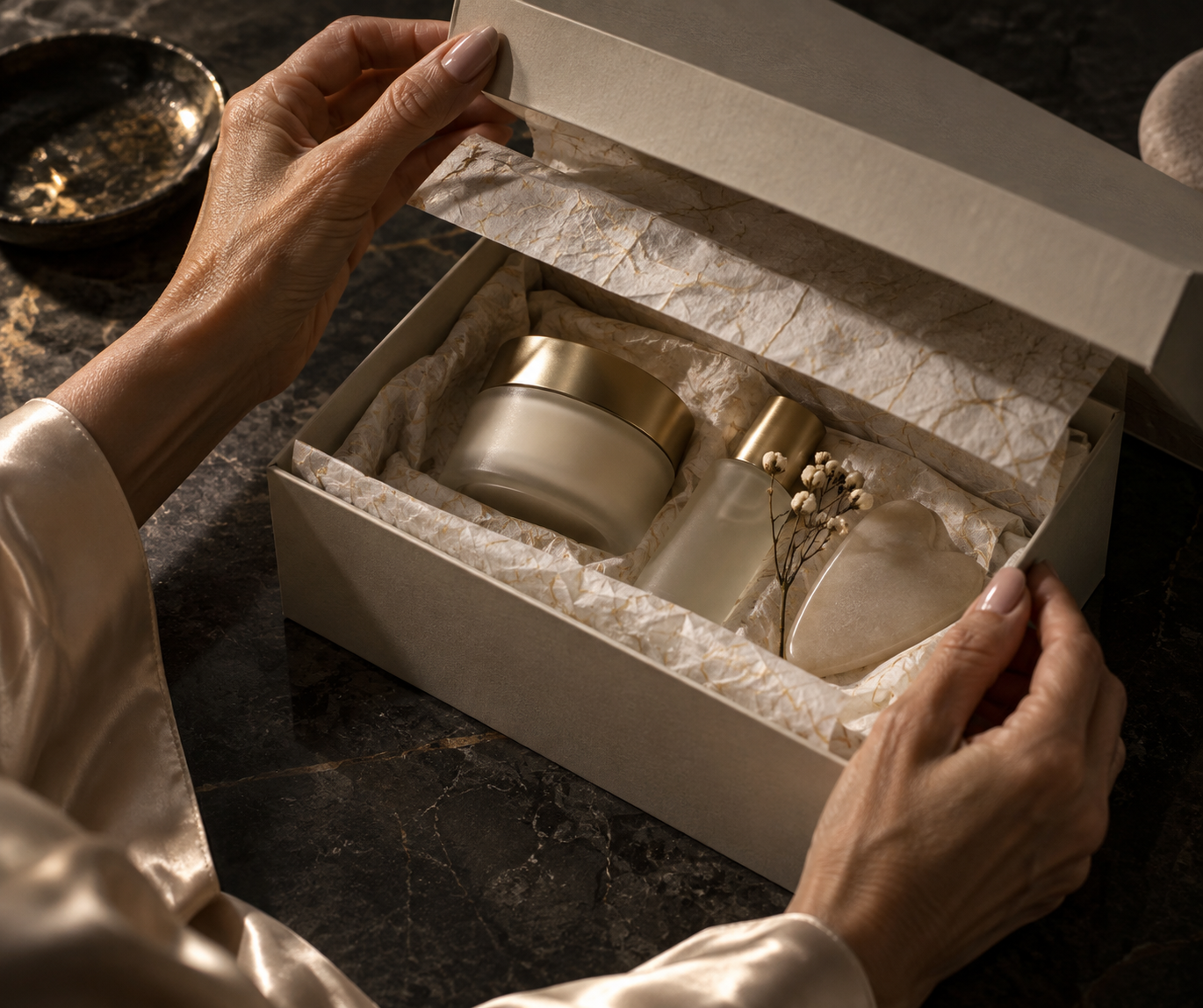 Hands opening a refined unbranded skincare ritual box